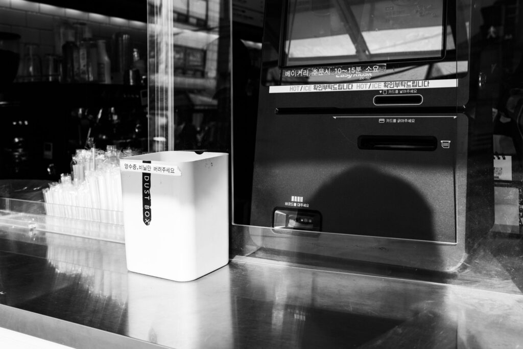 Black and White Photography, Coffee Shop Window in Seoul, South Korea. Street Photographer Donald MacDonell